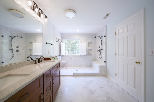 Spacious bathroom with large frameless glass shower